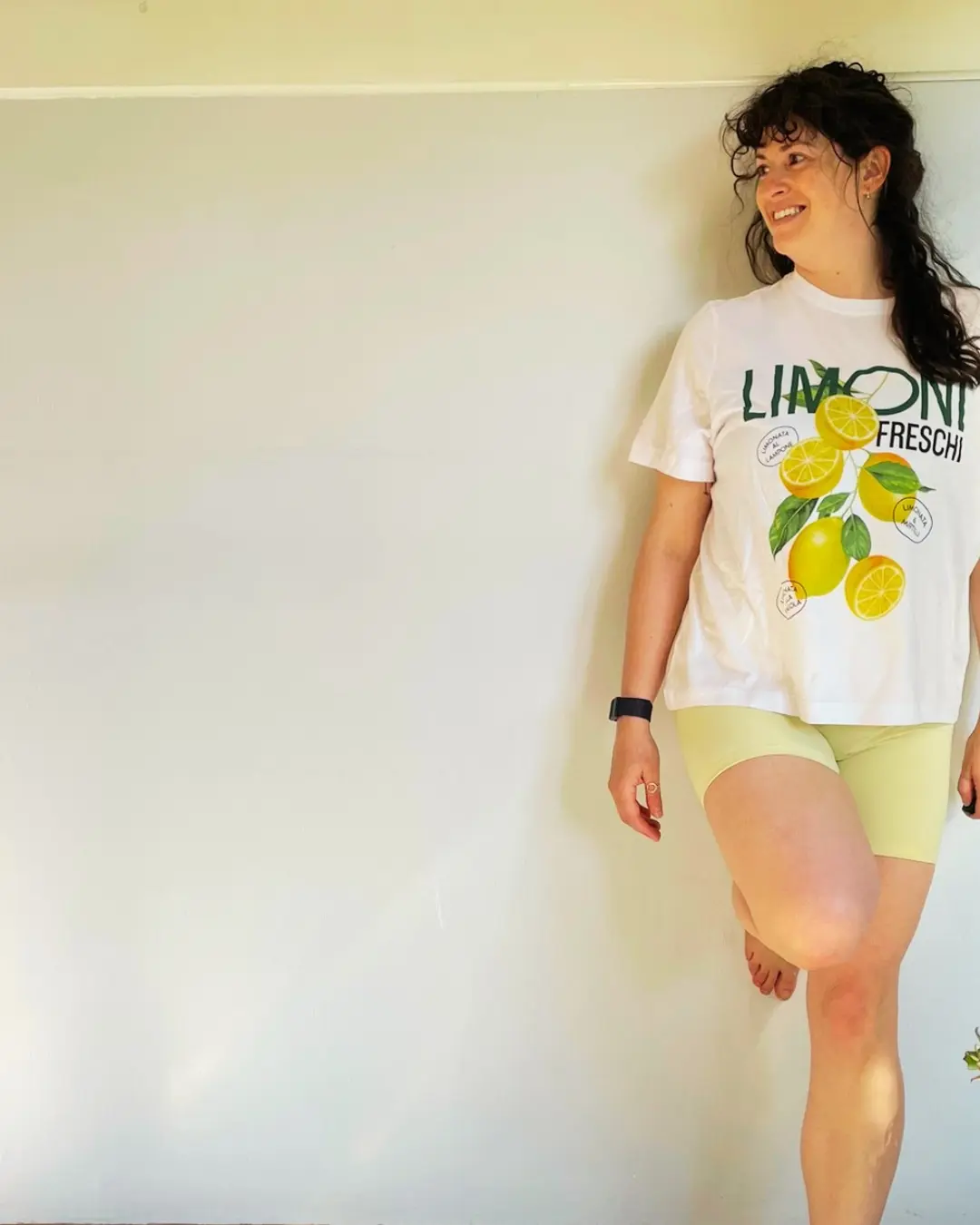 Kerry smiling in a lemon T-shirt