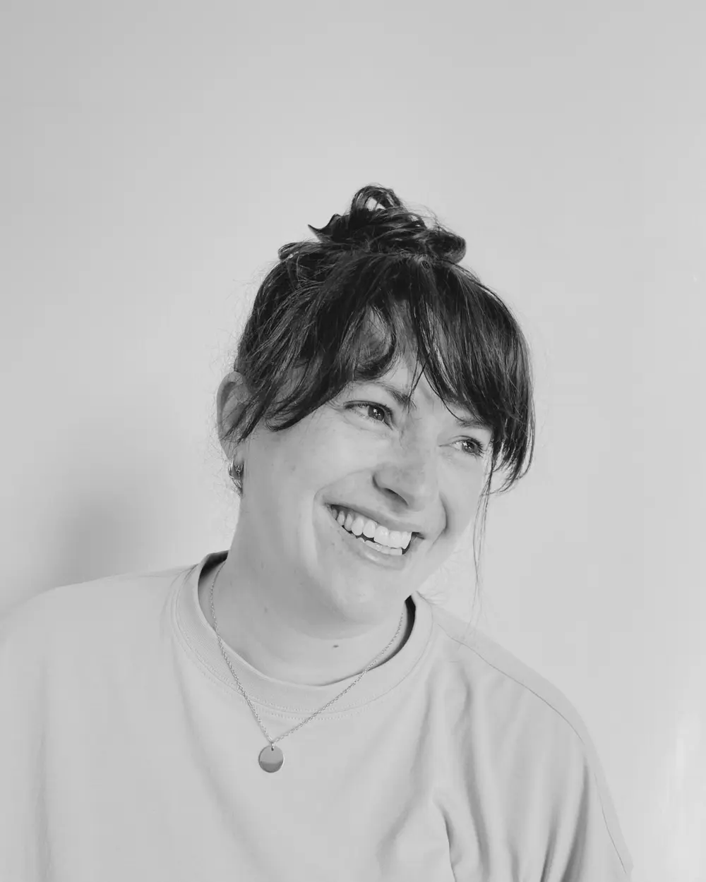 Black and white portrait of Kerry smiling